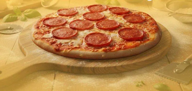 Freshly baked Pizza Toro pepperoni pizza on a wooden board